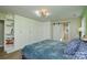 Primary bedroom with large closet and barn door to en suite bathroom at 6615 Love Mill Rd, Monroe, NC 28110