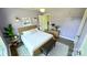 Bedroom with a queen bed, a bench, and a window view at 6615 Love Mill Rd, Monroe, NC 28110