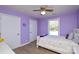 Lavender bedroom with a double bed, white dresser, and plenty of natural light at 6615 Love Mill Rd, Monroe, NC 28110