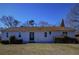 Charming single-story home with a well-maintained lawn and mature landscaping at 6615 Love Mill Rd, Monroe, NC 28110