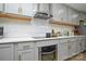 Modern kitchen with gray cabinets and stainless steel appliances at 6615 Love Mill Rd, Monroe, NC 28110