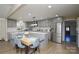 Renovated kitchen boasts stainless steel appliances and breakfast nook at 6615 Love Mill Rd, Monroe, NC 28110