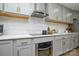 Modern kitchen with gray cabinets and stainless steel appliances at 6615 Love Mill Rd, Monroe, NC 28110