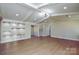 Spacious living room with hardwood floors and recessed lighting at 6615 Love Mill Rd, Monroe, NC 28110