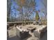 Outdoor patio with fire pit, seating, and a landscaped area at 6615 Love Mill Rd, Monroe, NC 28110