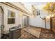 Small backyard with patio and AC unit at 7151 Stonington Ln, Charlotte, NC 28227