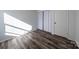 Bedroom with wood-look floors and window at 7151 Stonington Ln, Charlotte, NC 28227