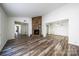 Living room showcasing a stone fireplace and an open floor plan at 7151 Stonington Ln, Charlotte, NC 28227