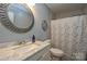 Bathroom boasts a marble vanity, updated fixtures, and a shower/tub combo at 7608 Woods Ln # 12, Cornelius, NC 28031