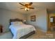 Main bedroom with ceiling fan and a dresser at 7608 Woods Ln # 12, Cornelius, NC 28031