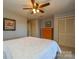 Main bedroom with ceiling fan and double door closet at 7608 Woods Ln # 12, Cornelius, NC 28031