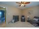 Bedroom with ceiling fan, gray armchairs, and a built-in cabinet at 7608 Woods Ln # 12, Cornelius, NC 28031