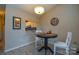 Small dining area with round table and two chairs at 7608 Woods Ln # 12, Cornelius, NC 28031