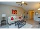 Living room with beige couch, coffee table and hardwood floors at 7608 Woods Ln # 12, Cornelius, NC 28031