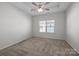 Spacious bedroom with ceiling fan and carpeted floor at 7840 Denmark Rd, Charlotte, NC 28273