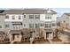 Front view of charming townhouses with gray siding and brick accents at 7840 Denmark Rd, Charlotte, NC 28273