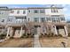 Townhouse with gray siding and stone accents at 7840 Denmark Rd, Charlotte, NC 28273