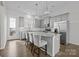 Modern kitchen with gray cabinets, granite counters, and island at 7840 Denmark Rd, Charlotte, NC 28273