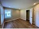 Well-lit bedroom with wood flooring and a closet at 808 Eastview St, Shelby, NC 28152