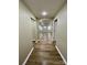 Bright hallway with hardwood floors leading to the living area at 808 Eastview St, Shelby, NC 28152