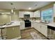 Modern kitchen with white cabinets, stainless steel appliances at 808 Eastview St, Shelby, NC 28152