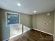 Laundry room with vinyl flooring and a window for natural light at 808 Eastview St, Shelby, NC 28152