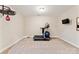 Basement exercise area equipped with a treadmill and TV at 829 Palmetto Bay Dr, Fort Mill, SC 29715