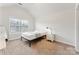 Bright bedroom features a neutral color scheme and window view at 829 Palmetto Bay Dr, Fort Mill, SC 29715