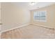 Carpeted bedroom with natural light from the window at 829 Palmetto Bay Dr, Fort Mill, SC 29715