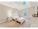 Bright bedroom featuring tray ceilings and a modern light fixture at 829 Palmetto Bay Dr, Fort Mill, SC 29715