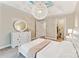 Bedroom featuring an elegant light fixture and a round mirror at 829 Palmetto Bay Dr, Fort Mill, SC 29715