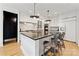 Stylish kitchen featuring a large island, marble backsplash, and stainless steel appliances at 829 Palmetto Bay Dr, Fort Mill, SC 29715