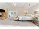 Bright main bedroom with high ceilings, a ceiling fan, and neutral tones at 829 Palmetto Bay Dr, Fort Mill, SC 29715