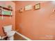 Simple bathroom with a toilet and peach colored walls at 846 Von Buren Blvd, Rock Hill, SC 29730