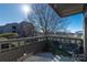 Enjoy the scenery from this cozy balcony overlooking a lake and a tree with chairs for relaxing outside at 9037 J M Keynes Dr # 23, Charlotte, NC 28262