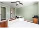 Bedroom with light green walls featuring hardwood floors and natural light at 9037 J M Keynes Dr # 23, Charlotte, NC 28262