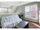 Living room with sofa, table, and window with view at 9037 J M Keynes Dr # 23, Charlotte, NC 28262