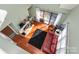 Sunlit living room showcasing hardwood floors, fireplace, and access to outdoor patio at 9037 J M Keynes Dr # 23, Charlotte, NC 28262