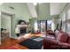 Inviting living room featuring a fireplace, hardwood floors, and lots of natural light at 9037 J M Keynes Dr # 23, Charlotte, NC 28262