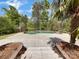 Inviting kidney-shaped pool with large concrete patio and landscaping at 918 Clover Park Dr, Clover, SC 29710