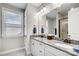 Bathroom featuring dual sinks, granite countertops, white cabinets and tile flooring at 9428 Liberty Hill Dr, Mint Hill, NC 28227