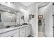 Double vanity bathroom with granite countertop and large mirror at 9428 Liberty Hill Dr, Mint Hill, NC 28227