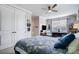 Bright and inviting bedroom featuring a ceiling fan, window, double closets and carpet at 9428 Liberty Hill Dr, Mint Hill, NC 28227