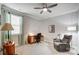 Bright bedroom featuring a ceiling fan, neutral walls, a window, and an office space at 9428 Liberty Hill Dr, Mint Hill, NC 28227