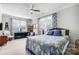 Comfortable bedroom featuring a ceiling fan, two windows, carpet and a neutral color palette at 9428 Liberty Hill Dr, Mint Hill, NC 28227