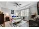 Main bedroom with hardwood floors, a ceiling fan and large windows at 9428 Liberty Hill Dr, Mint Hill, NC 28227