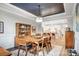 Bright dining room features a mid-century modern table set and an open concept to the kitchen at 9428 Liberty Hill Dr, Mint Hill, NC 28227