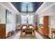 Formal dining room showcasing modern light fixture, stylish decor, and neutral tones with elegant wainscoting at 9428 Liberty Hill Dr, Mint Hill, NC 28227