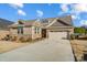 Charming brick home with a two-car garage, well-maintained lawn, and inviting curb appeal at 9428 Liberty Hill Dr, Mint Hill, NC 28227