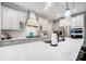 Modern kitchen with white cabinets, a large island, and stainless steel appliances at 9428 Liberty Hill Dr, Mint Hill, NC 28227